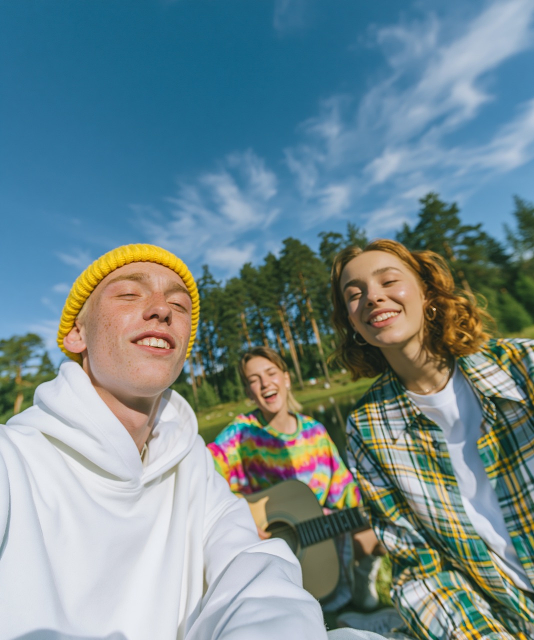 Young friends spending time outdoors with music